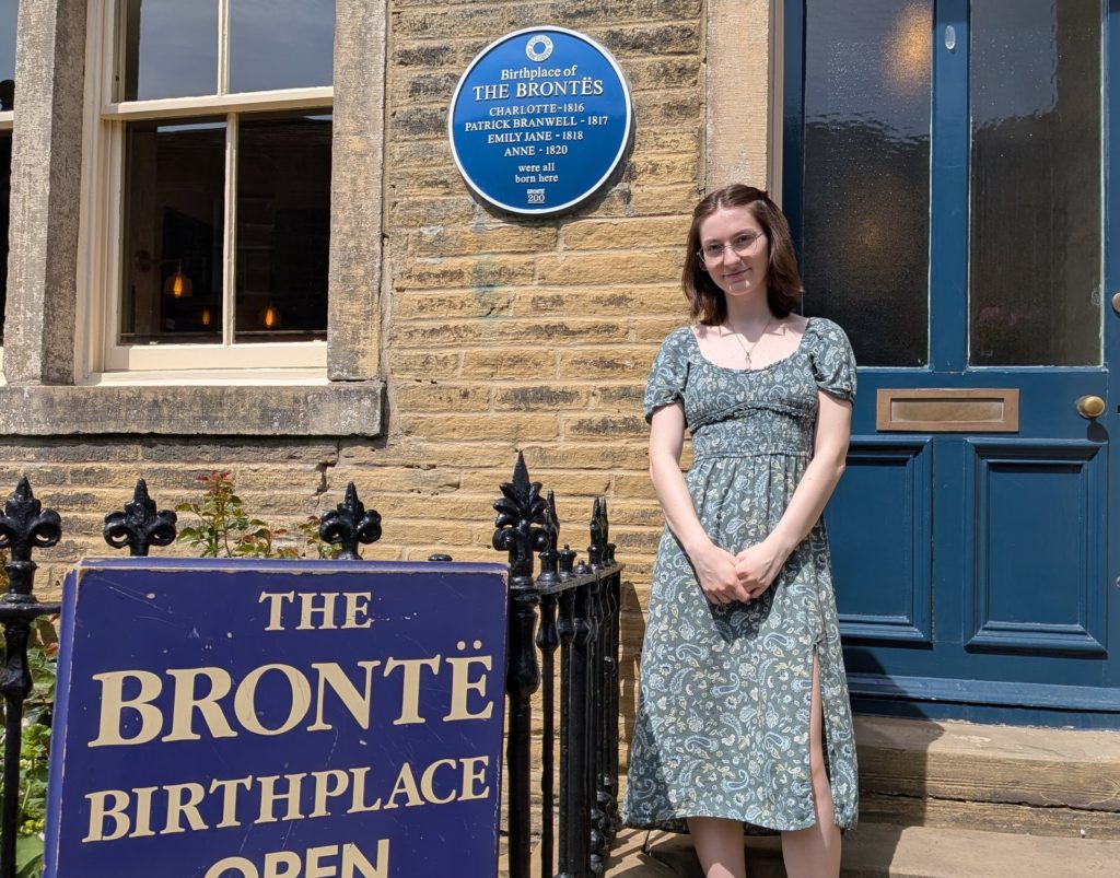A young female stood on the steps of the bronte birthplace